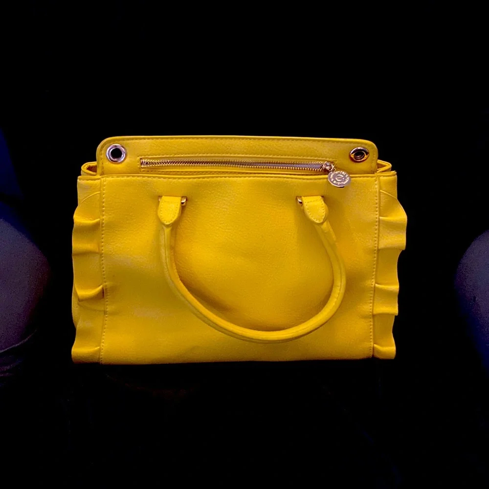 YELLOW EVA MENDES NEW YORK & COMPANY HANDBAG. It has 2 dividers with zippers.